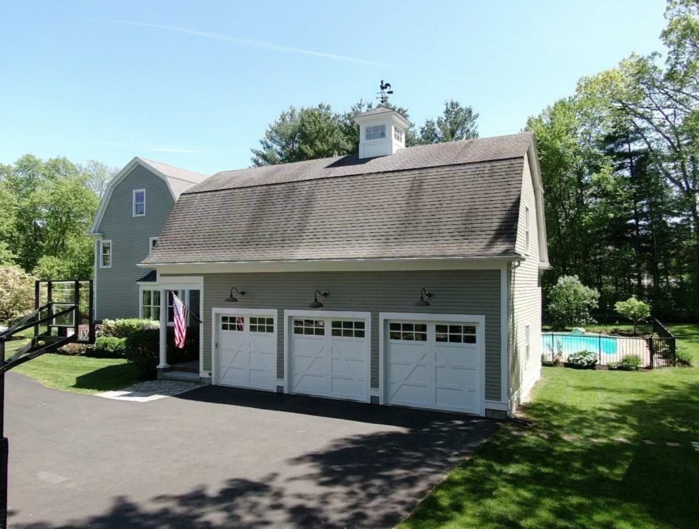 19 Marked Tree Road Sudbury, MA 01776 - Photo 39 of 42 a front view of a house with a garden