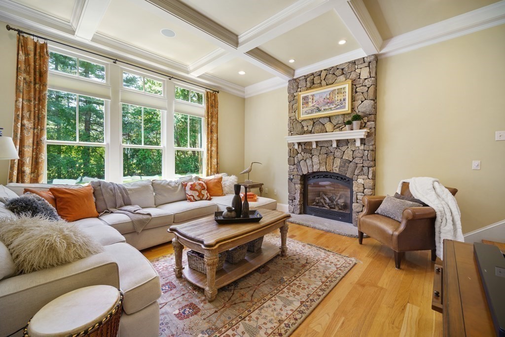 19 Marked Tree Road Sudbury, MA 01776 - Photo 9 of 42 a living room with furniture fireplace and a large window