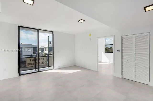 a large kitchen with a stove and a sink