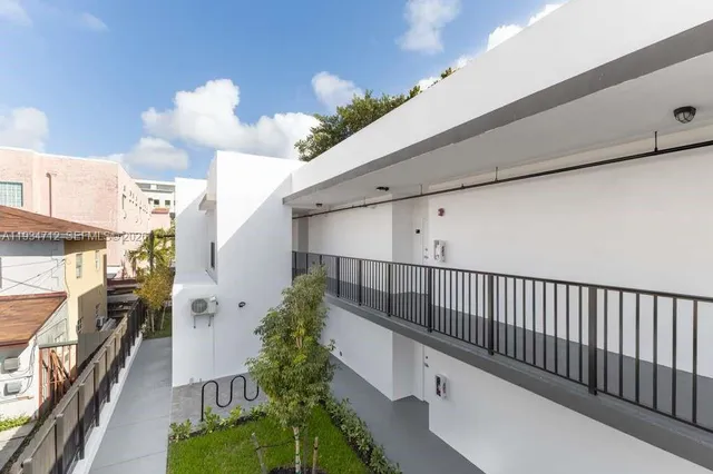a view of a hallway with windows