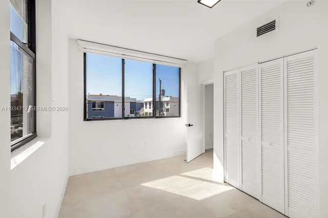 an empty room with windows