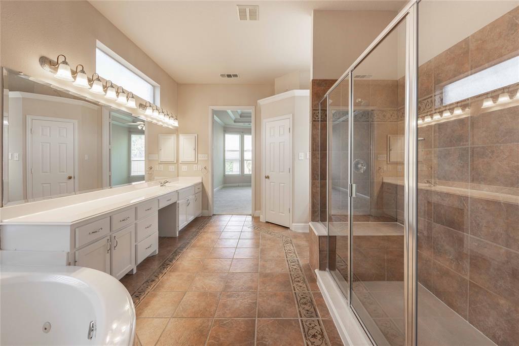 2009 Briarbrook Lane Allen, TX 75002 - Photo 20 of 40 a large bathroom with a glass shower door