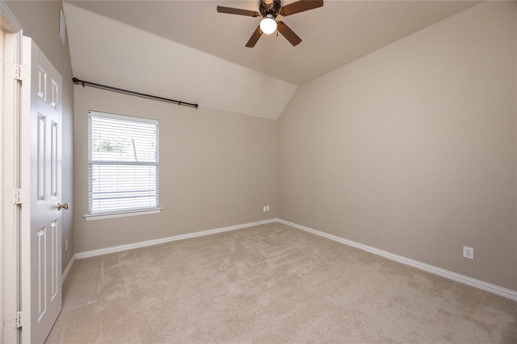 2009 Briarbrook Lane Allen, TX 75002 - Photo 22 of 40 an empty room with a window and a fan