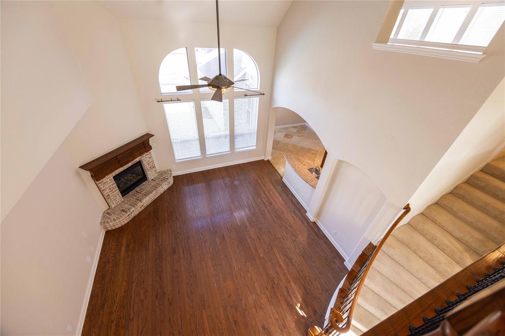 2009 Briarbrook Lane Allen, TX 75002 - Photo 27 of 40 a view of empty room with wooden floor and fan