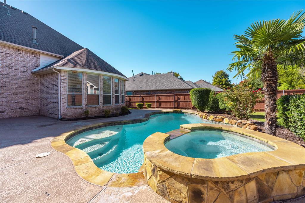 2009 Briarbrook Lane Allen, TX 75002 - Photo 36 of 40 a swimming pool with outdoor seating yard and barbeque oven