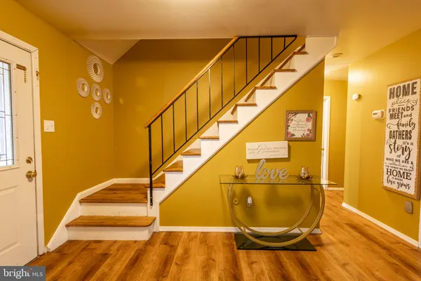 a white toilet sitting next to a shower curtain