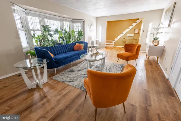 a view of a livingroom with workspace and a window