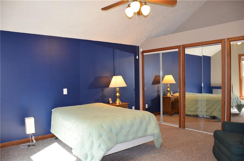 164 Householder Road New Brighton, PA 15066 - Photo 12 of 22 Bedroom on upper level features a vaulted ceiling, ceiling fan, and shelf above the triple closet