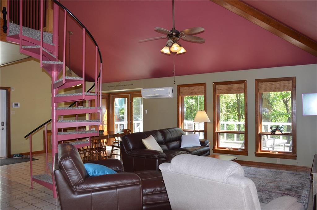 164 Householder Road New Brighton, PA 15066 - Photo 7 of 22 Wall of windows look out to the deck and woods