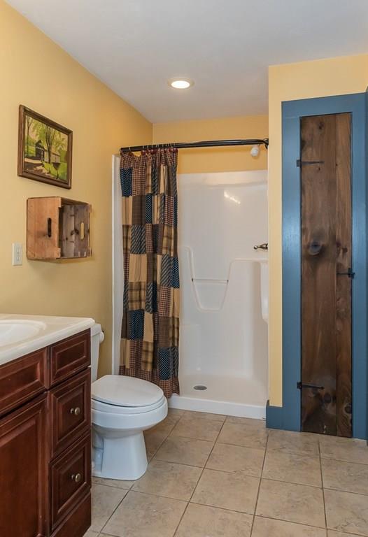 256 Greenwich Road Ware, MA 01082 - Photo 29 of 42 a bathroom with a toilet a sink and shower