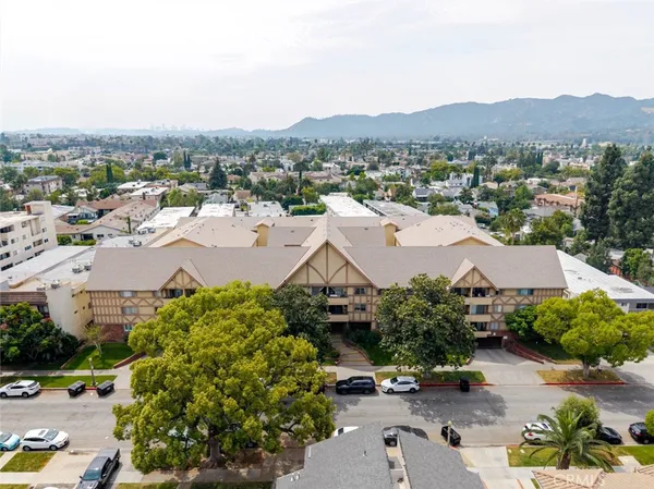an aerial view of residential houses and outdoor space