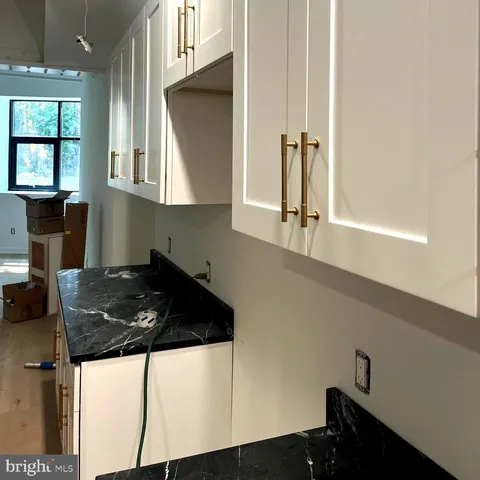 a kitchen with a sink and a window