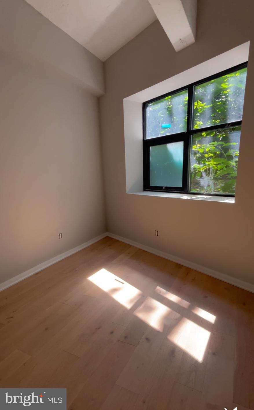 36 North Narberth Avenue, Unit 1B Narberth, PA 19072 - Photo 7 of 7 a view of an empty room with a window
