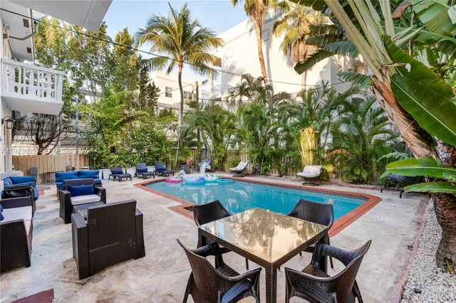 a outdoor space with a table and chairs