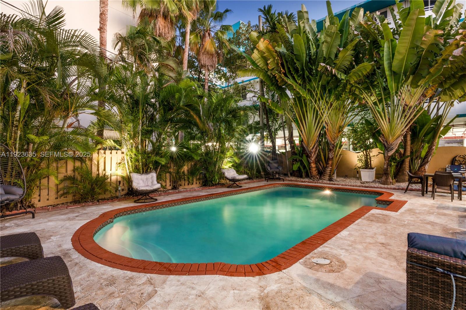 9167 Harding Avenue, Unit 9167 Surfside, FL 33154 - Photo 30 of 45 a view of a swimming pool with a patio
