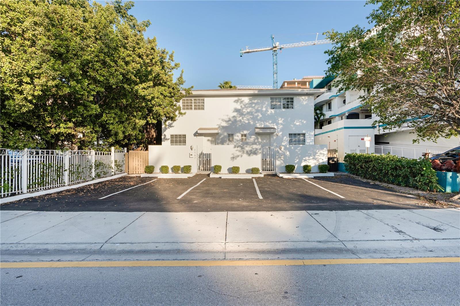 9167 Harding Avenue, Unit 9167 Surfside, FL 33154 - Photo 33 of 45 a view of a street that has a tree