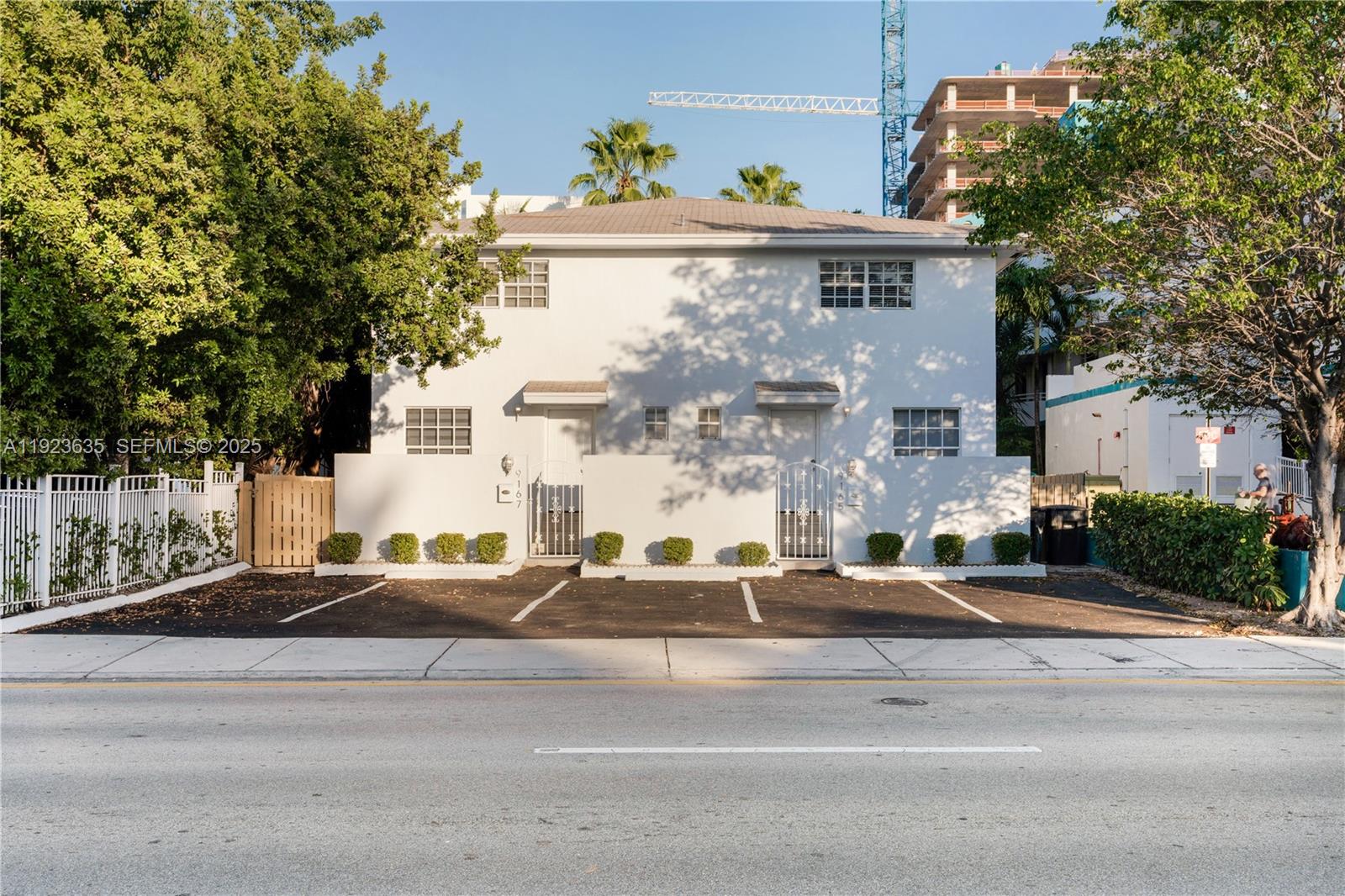 9167 Harding Avenue, Unit 9167 Surfside, FL 33154 - Photo 34 of 45 a front view of a house with a yard