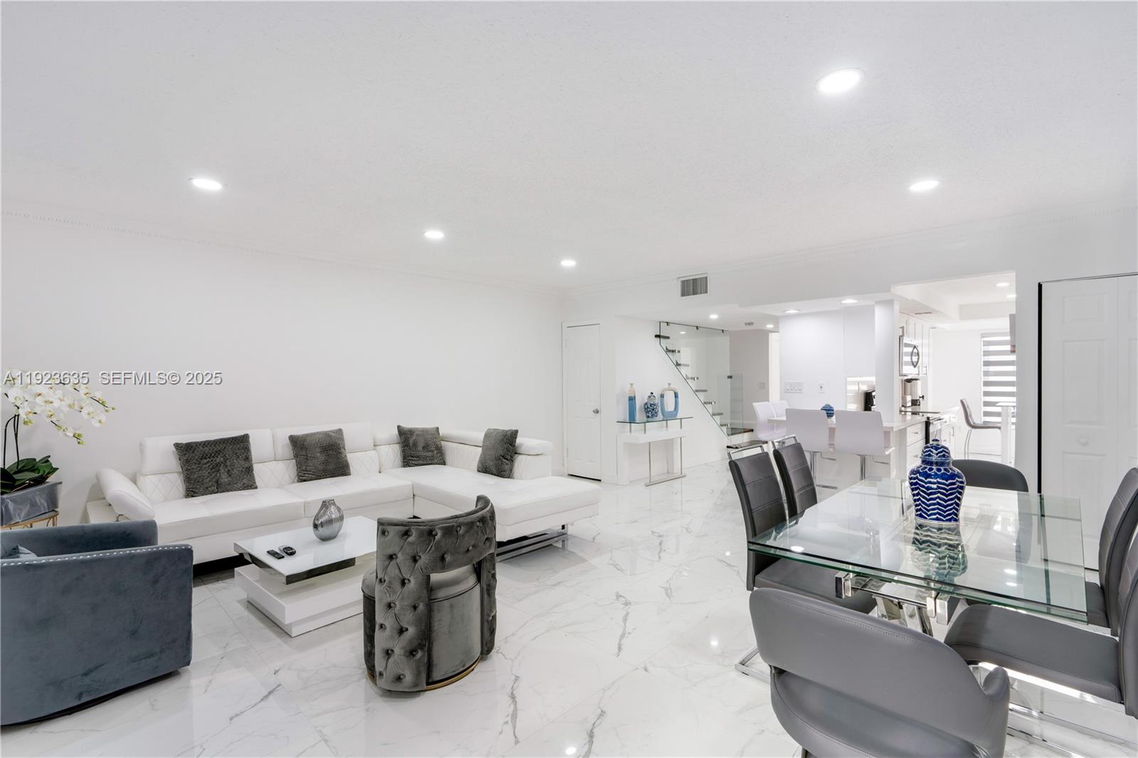 9167 Harding Avenue, Unit 9167 Surfside, FL 33154 - Photo 6 of 45 a living room with furniture