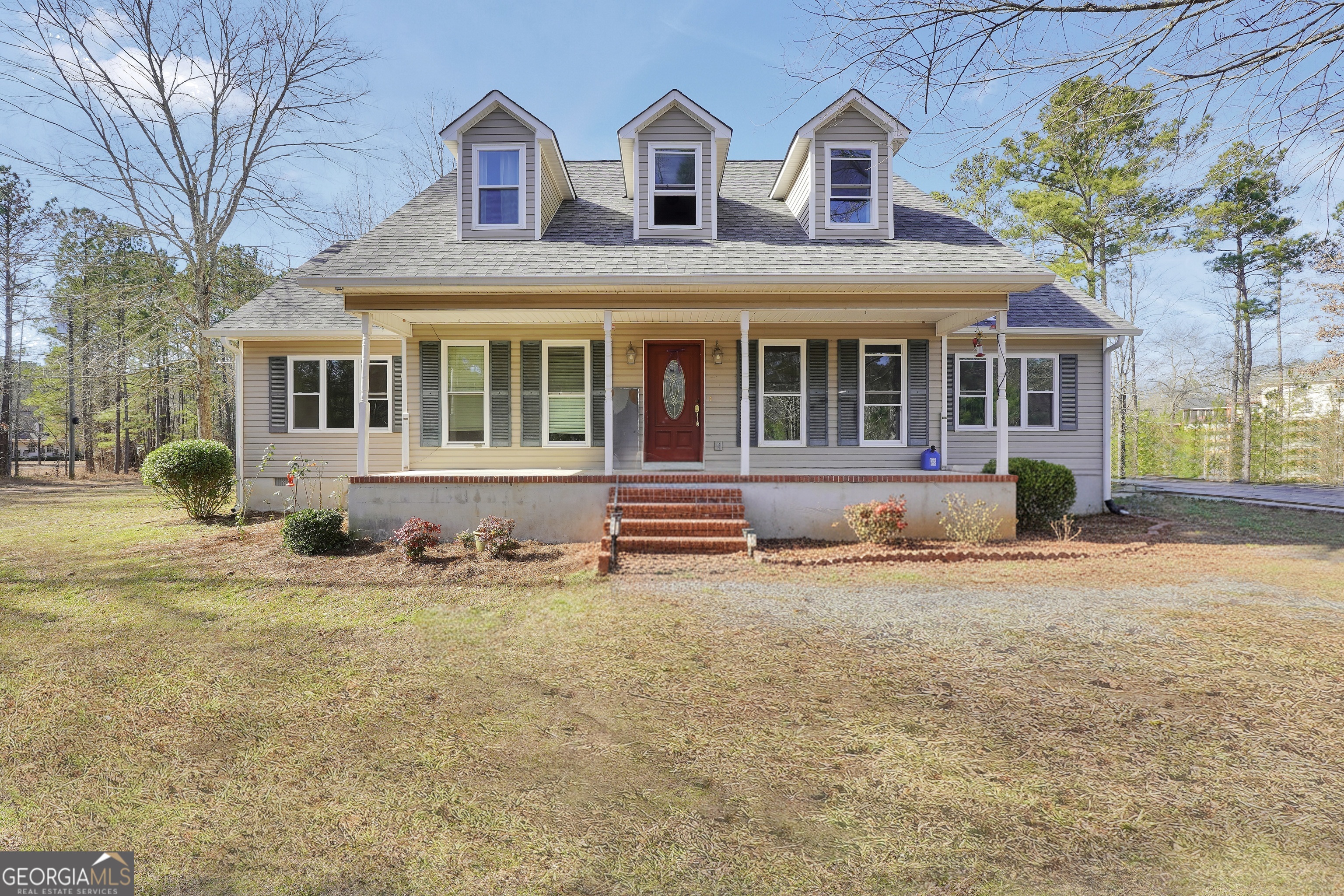119 Bagley Road Forsyth, GA 31029 - Photo 1 of 36 a front view of a house with a yard and garage
