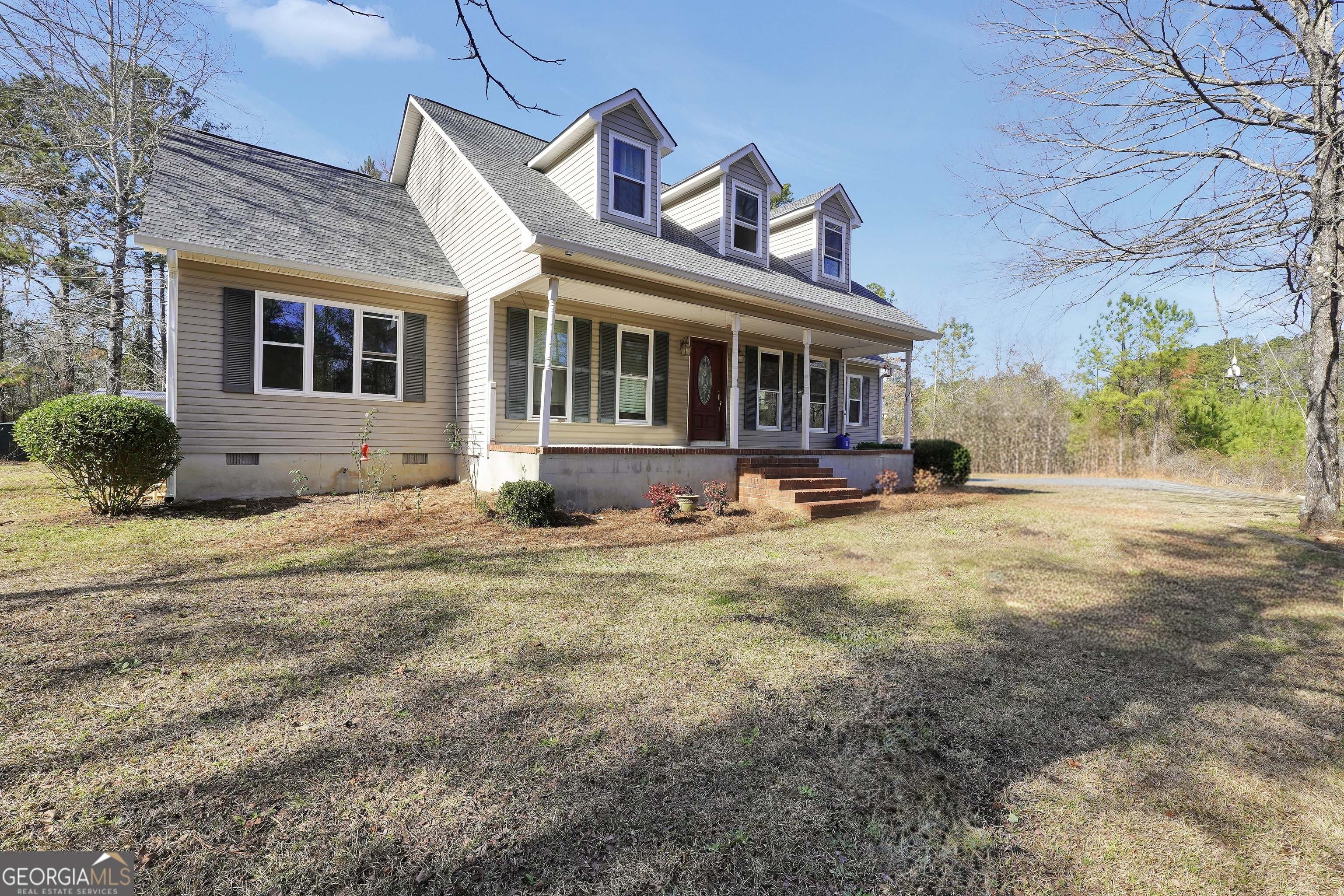 119 Bagley Road Forsyth, GA 31029 - Photo 2 of 36 a front view of a house with a yard
