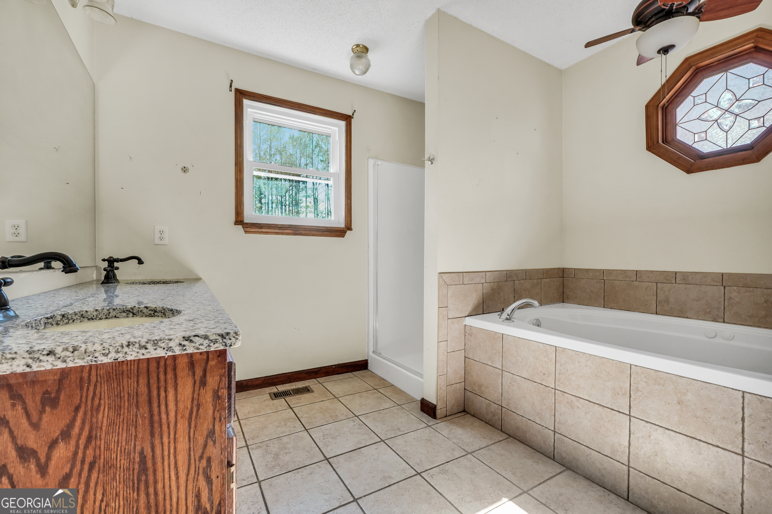 119 Bagley Road Forsyth, GA 31029 - Photo 21 of 36 a bathroom with a sink and a mirror