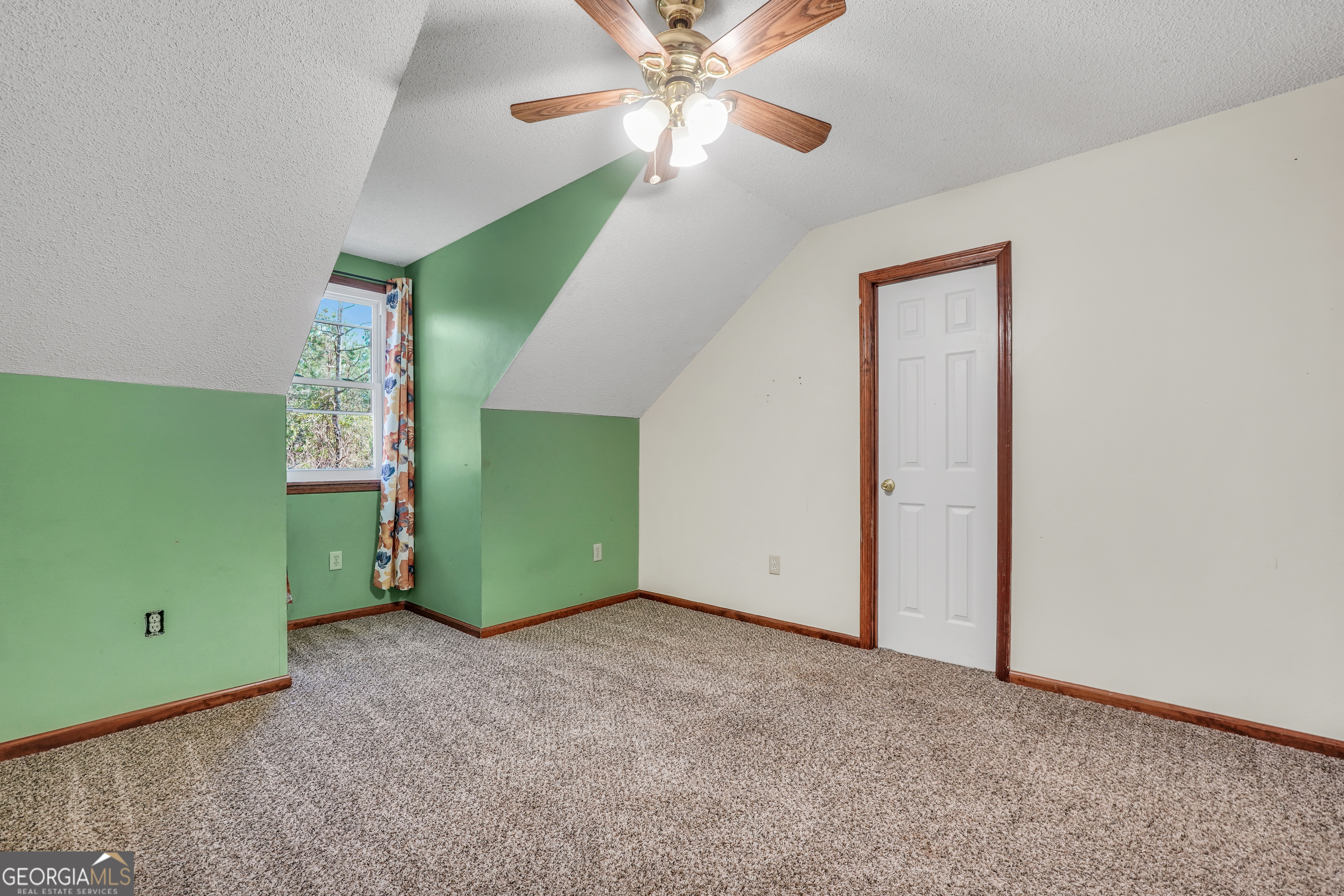 119 Bagley Road Forsyth, GA 31029 - Photo 25 of 36 a view of a room that has a fan and a ceiling fan