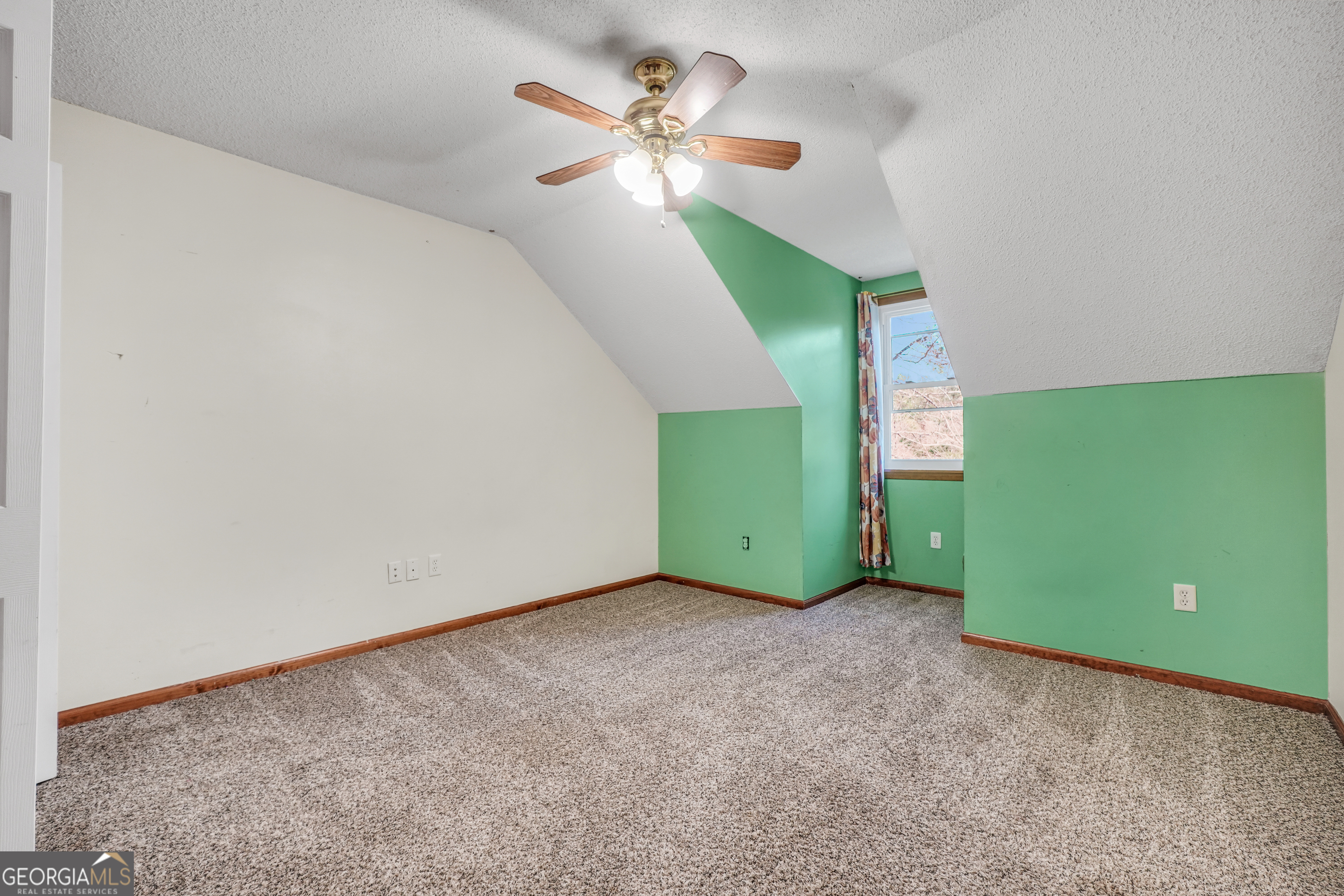 119 Bagley Road Forsyth, GA 31029 - Photo 26 of 36 a view of a room with window ceiling fan and table