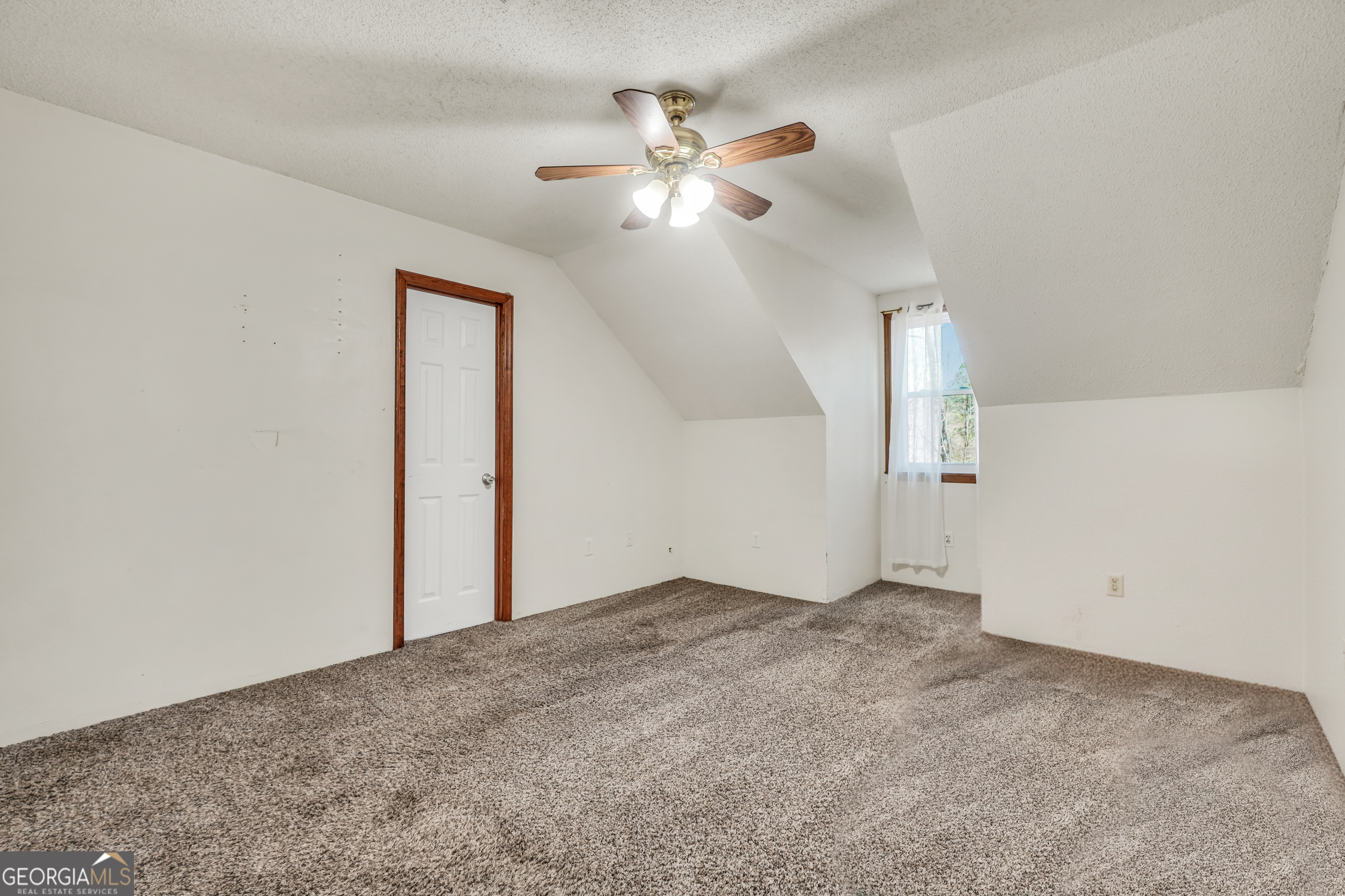 119 Bagley Road Forsyth, GA 31029 - Photo 28 of 36 an empty room with fan and windows