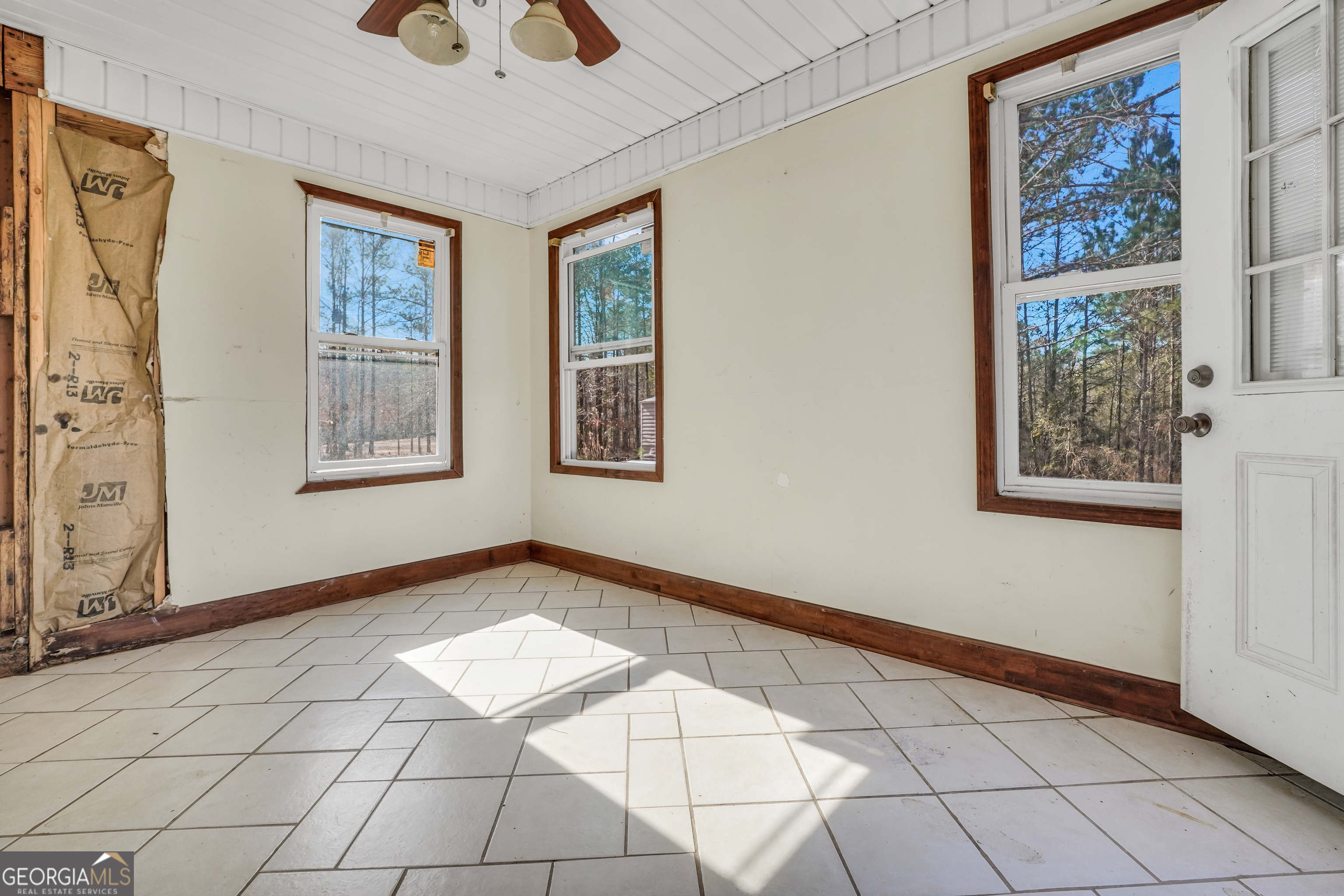 119 Bagley Road Forsyth, GA 31029 - Photo 34 of 36 a view of an empty room with window and chandelier fan