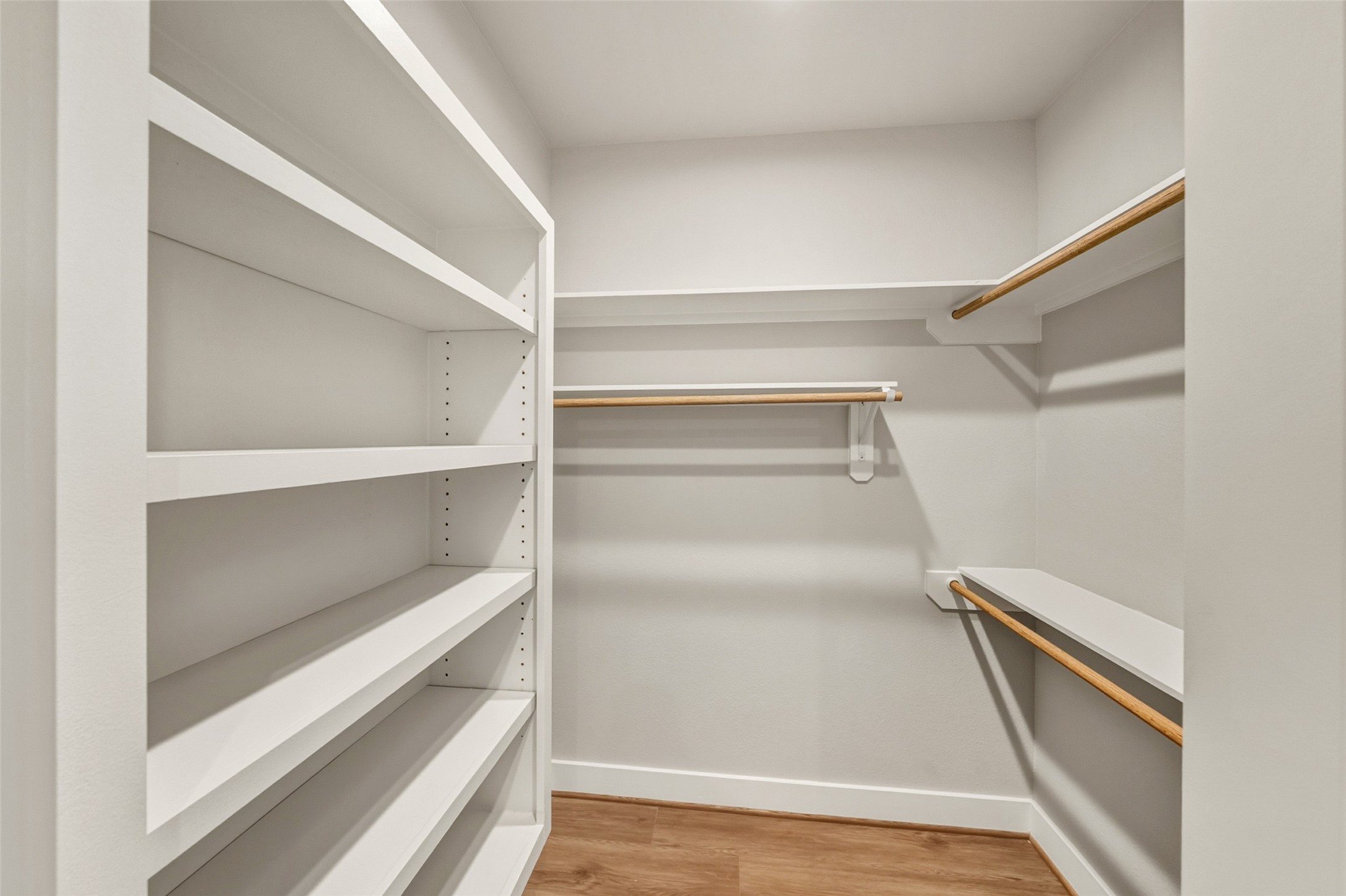 3424 Elser Street Houston, TX 77009 - Photo 14 of 36 a view of walk in closet with empty racks