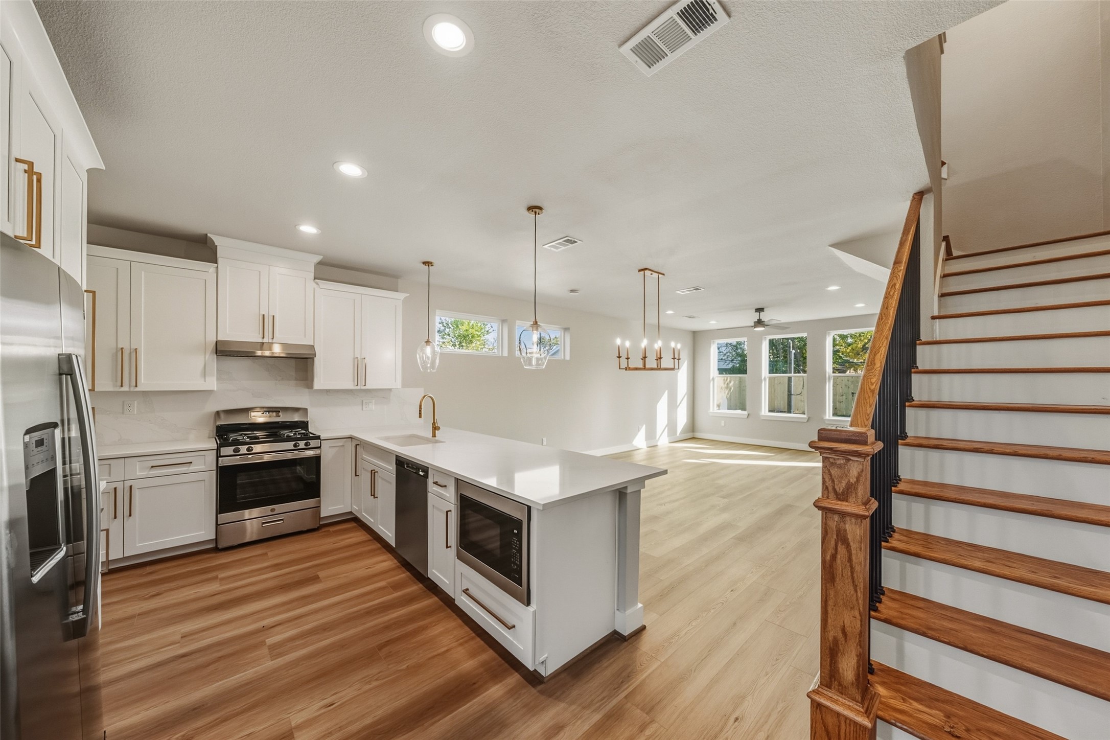 3424 Elser Street Houston, TX 77009 - Photo 6 of 36 a kitchen with stainless steel appliances granite countertop a stove and a refrigerator