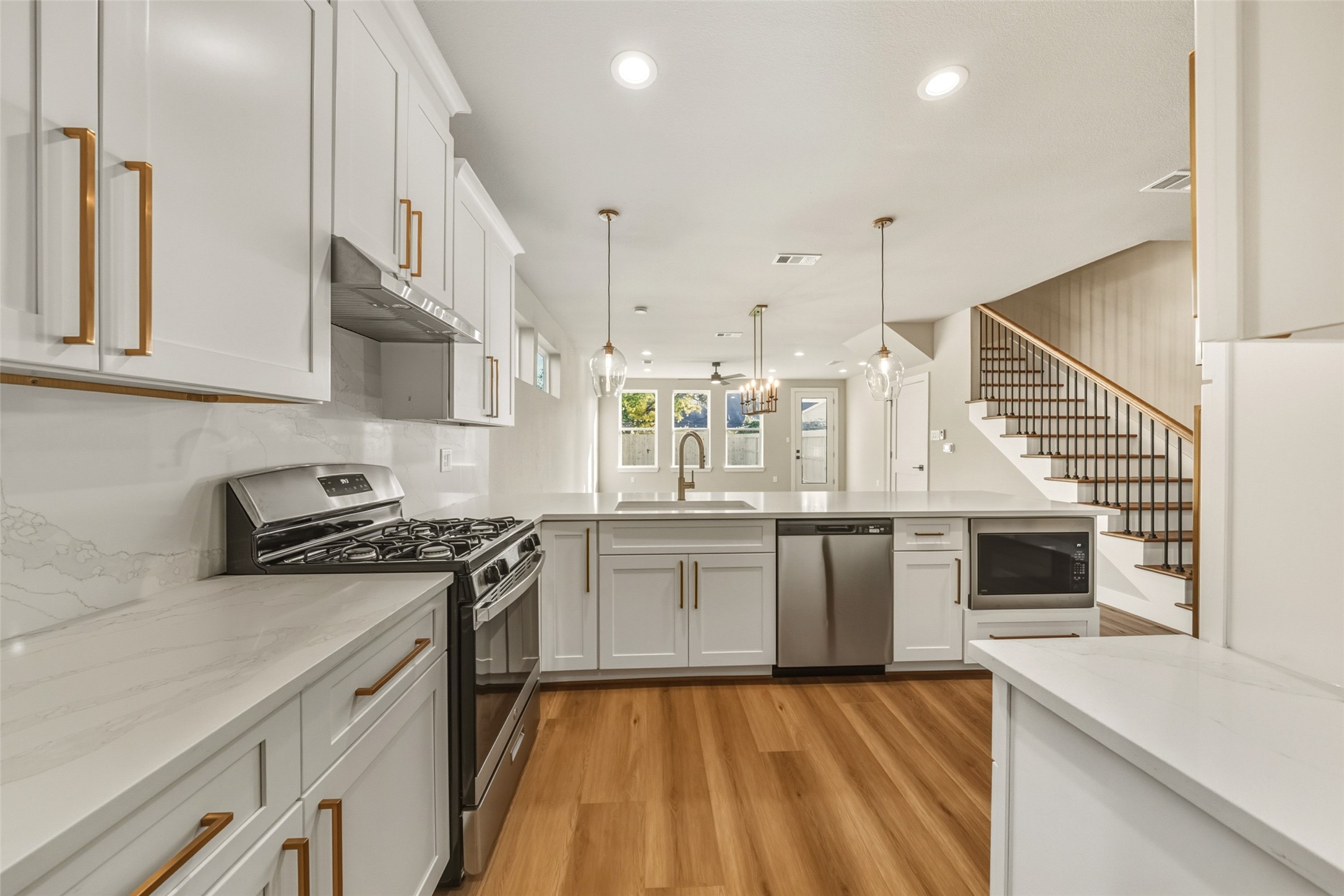3424 Elser Street Houston, TX 77009 - Photo 7 of 36 a kitchen with a stove a sink and a refrigerator