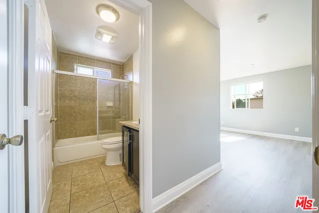 a bathroom with a bathtub and a toilet