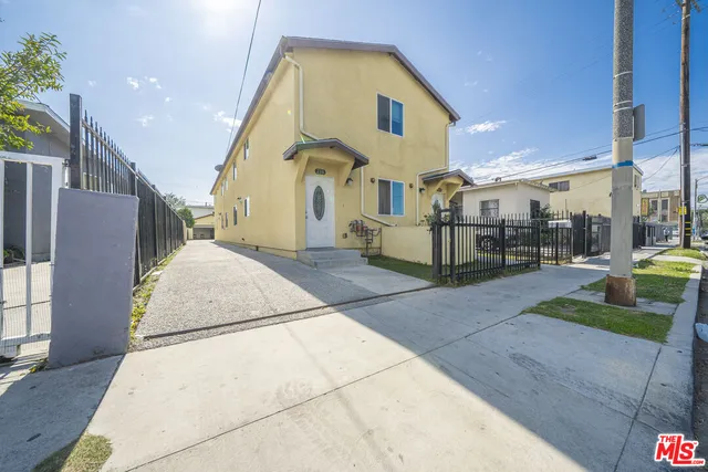 a view of a building with sitting area