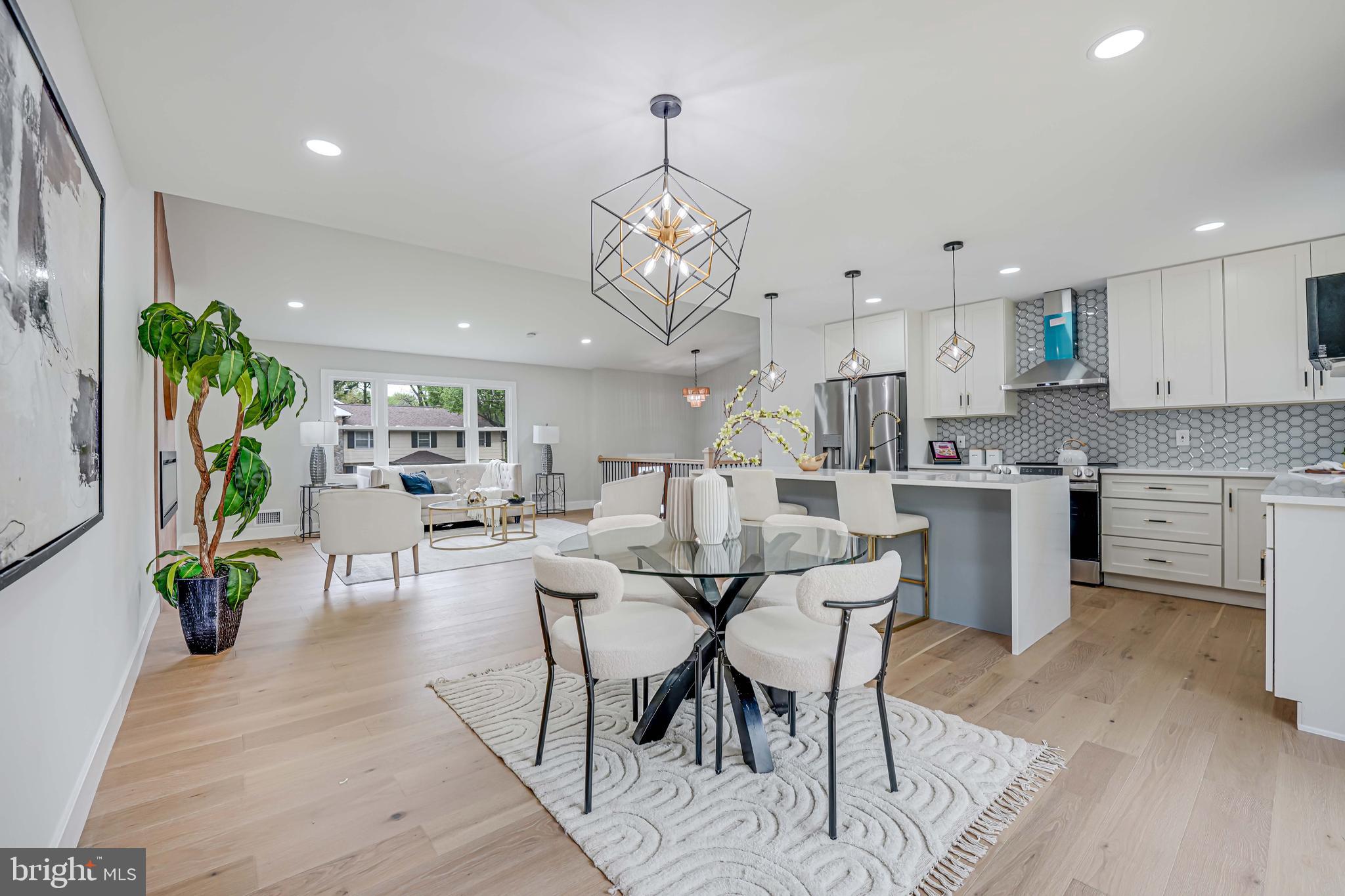 8643 Gateshead Road Alexandria, VA 22309 - Photo 13 of 40 a view of a dining room with furniture and a chandelier