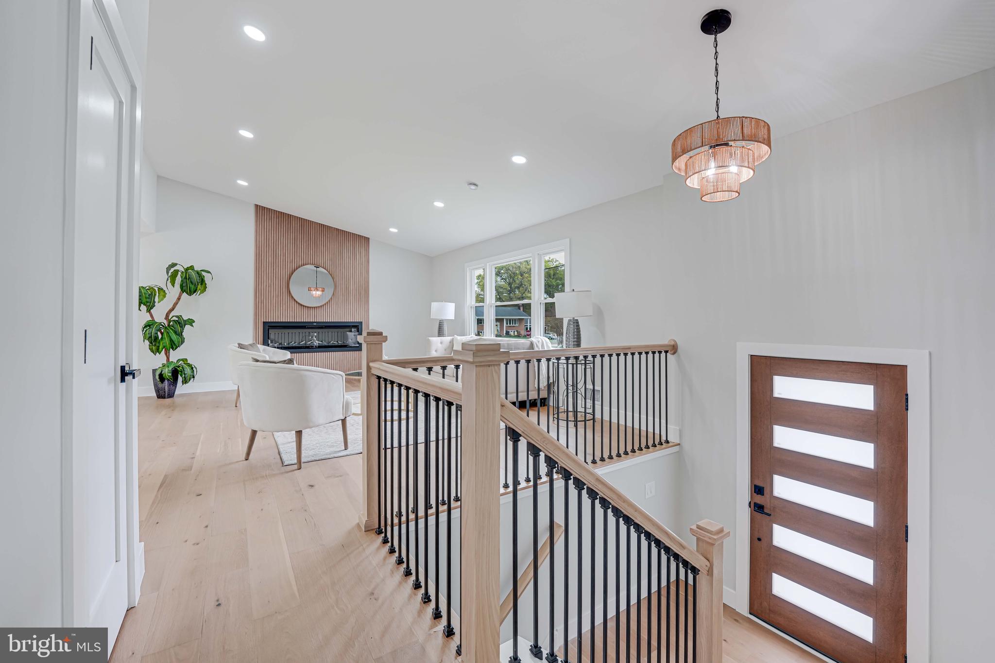 8643 Gateshead Road Alexandria, VA 22309 - Photo 15 of 40 a view of dining room and hall with wooden floor
