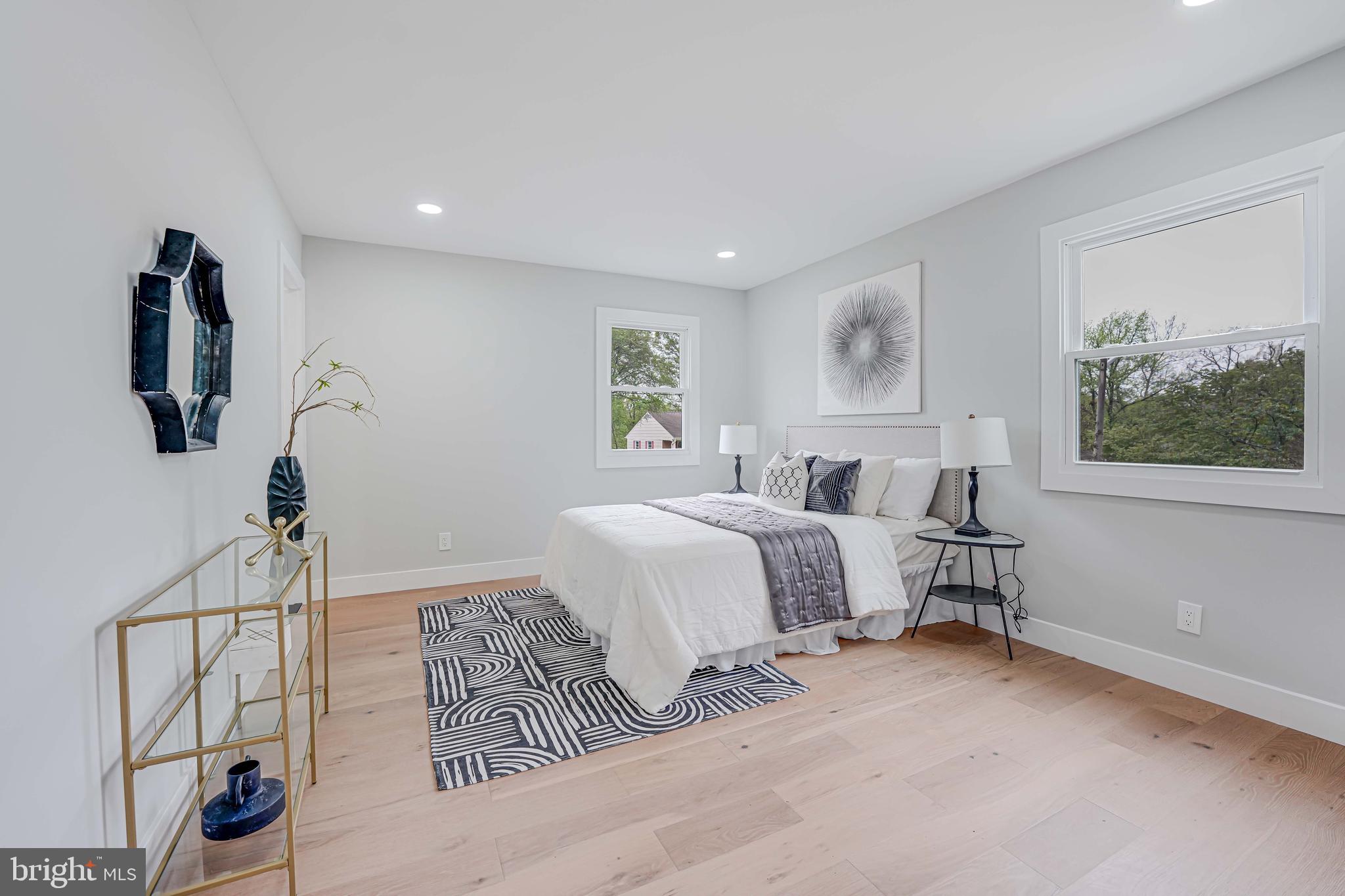 8643 Gateshead Road Alexandria, VA 22309 - Photo 16 of 40 a bedroom with a bed and a painting on the wall