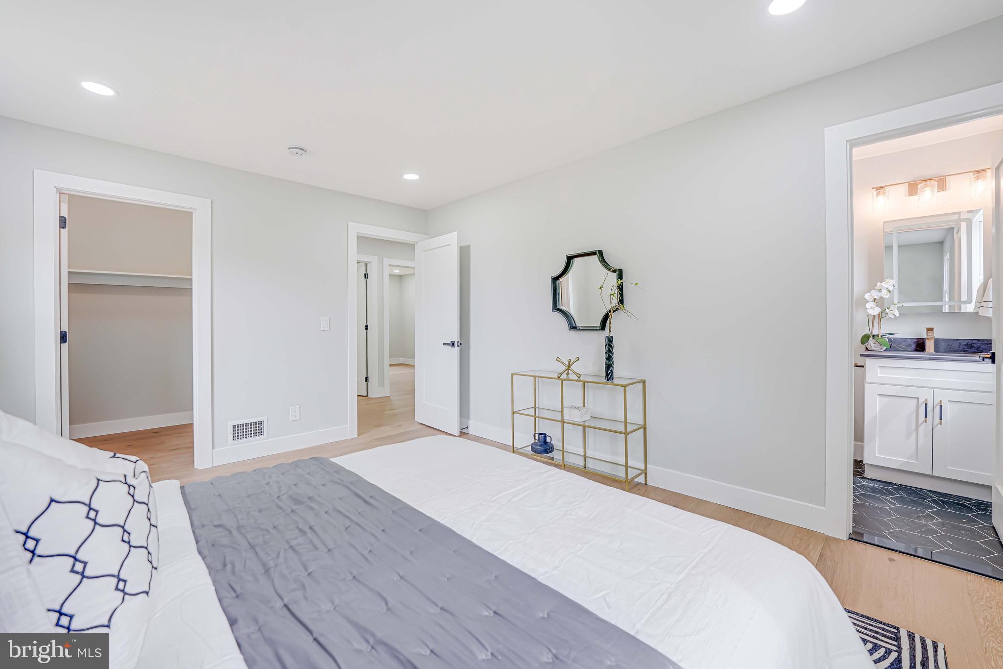 8643 Gateshead Road Alexandria, VA 22309 - Photo 17 of 40 a bedroom with a bed and a sink
