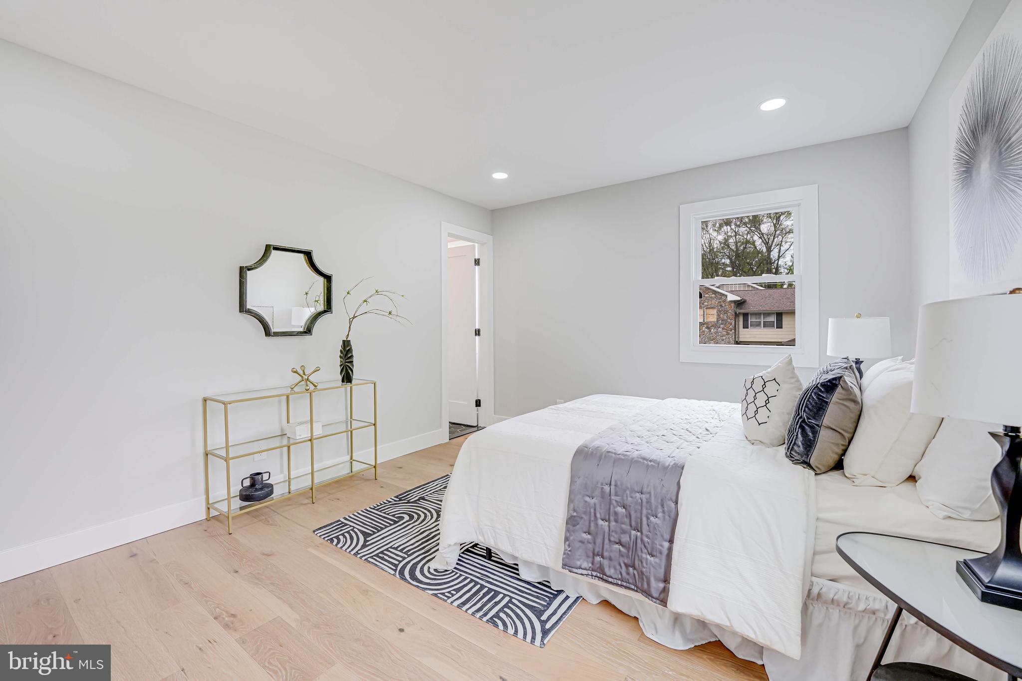 8643 Gateshead Road Alexandria, VA 22309 - Photo 18 of 40 a bedroom with a bed and window
