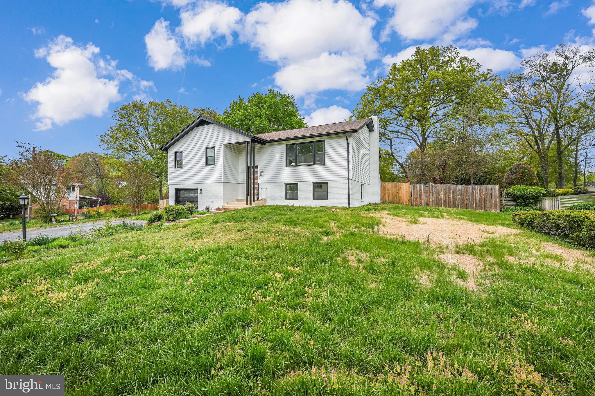 8643 Gateshead Road Alexandria, VA 22309 - Photo 2 of 40 a front view of a house with a yard