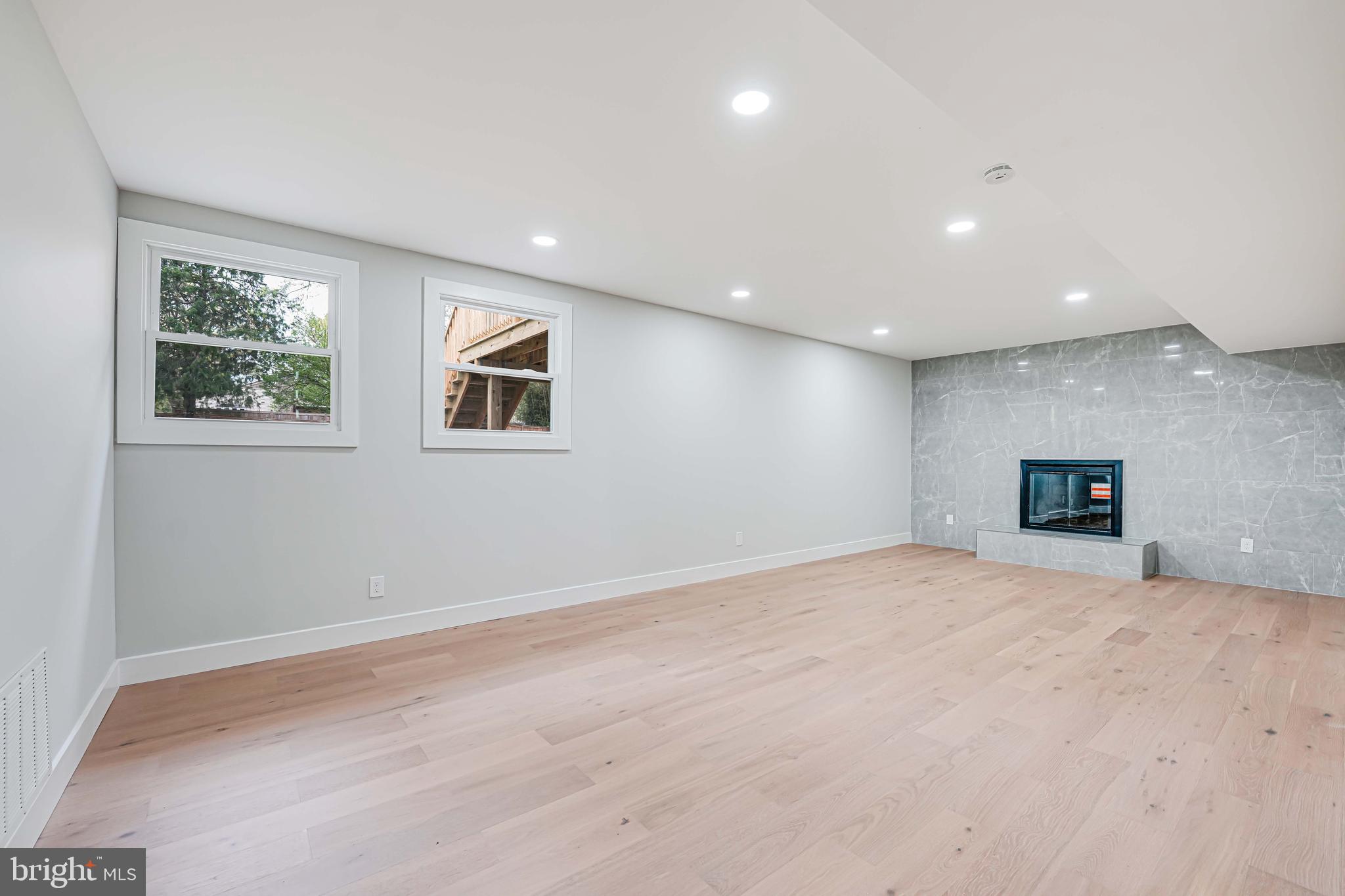 8643 Gateshead Road Alexandria, VA 22309 - Photo 27 of 40 a view of an empty room with a window and a fireplace