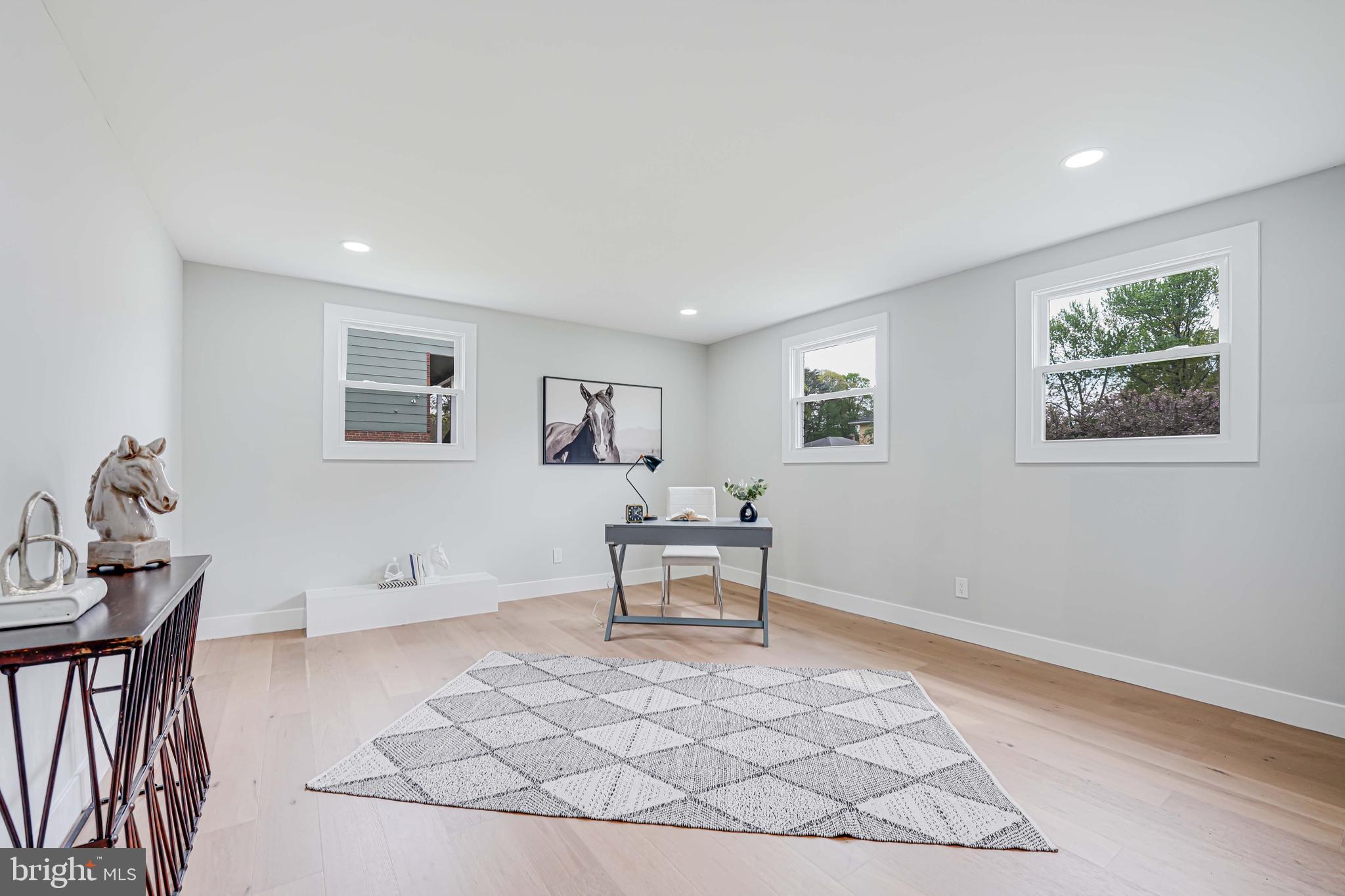 8643 Gateshead Road Alexandria, VA 22309 - Photo 30 of 40 a living room with furniture and a table