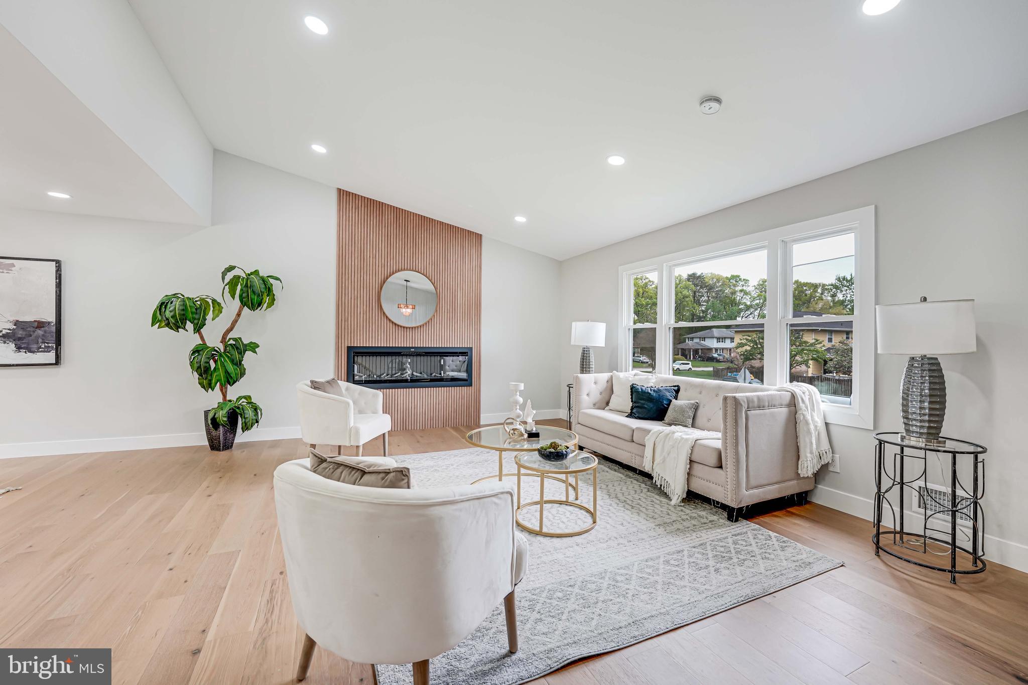 8643 Gateshead Road Alexandria, VA 22309 - Photo 3 of 40 a living room with furniture and a wooden floor