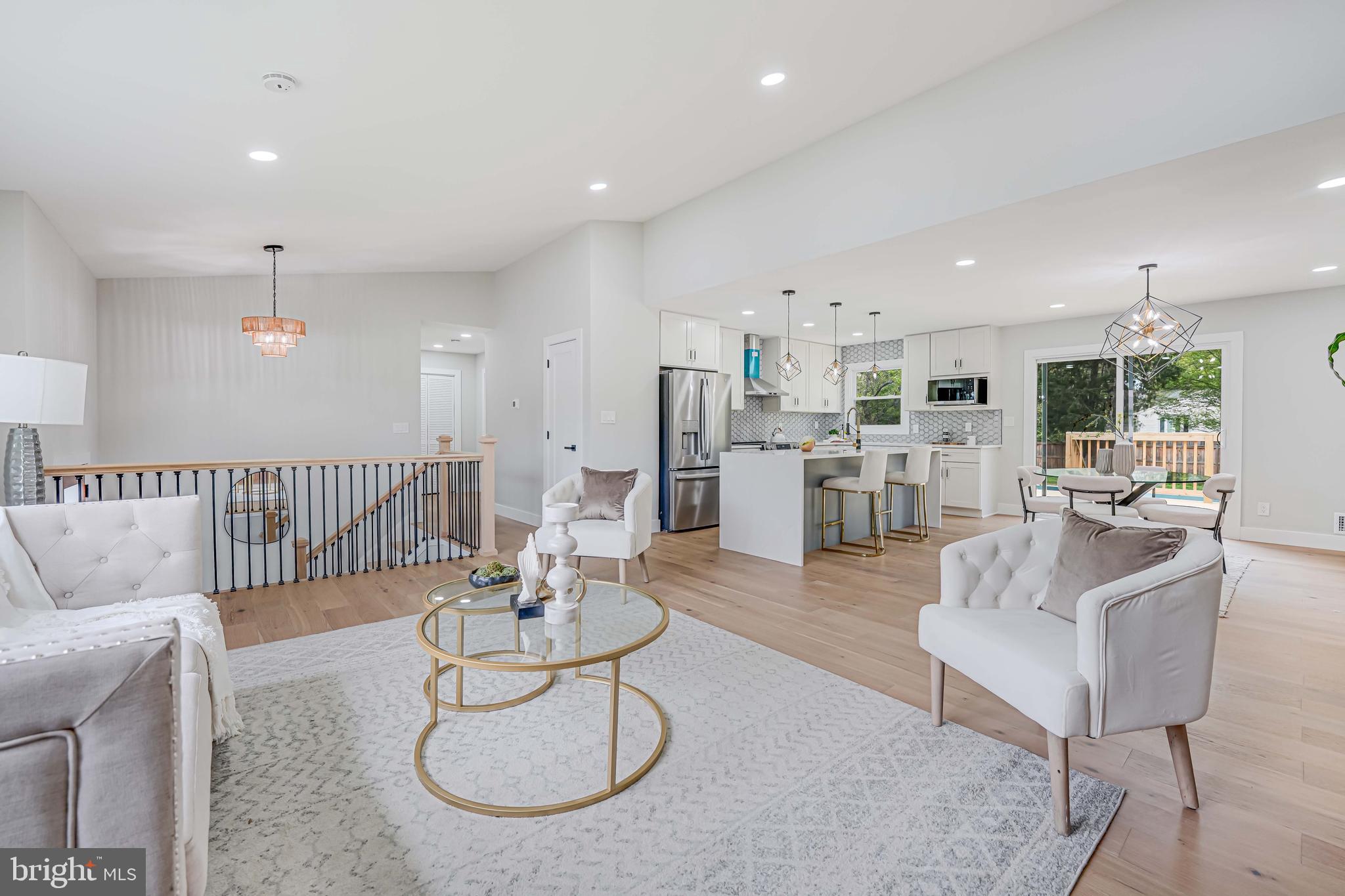 8643 Gateshead Road Alexandria, VA 22309 - Photo 5 of 40 a living room with furniture kitchen view and a table