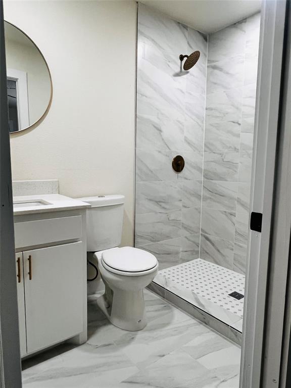3719 Meadow Street Dallas, TX 75215 - Photo 14 of 18 a bathroom with a sink a toilet and shower