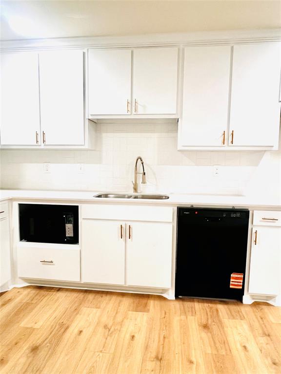 3719 Meadow Street Dallas, TX 75215 - Photo 5 of 18 a kitchen with granite countertop a sink and a stove