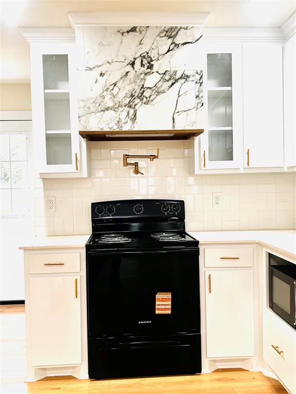 3719 Meadow Street Dallas, TX 75215 - Photo 8 of 18 a stove top oven sitting inside of a kitchen