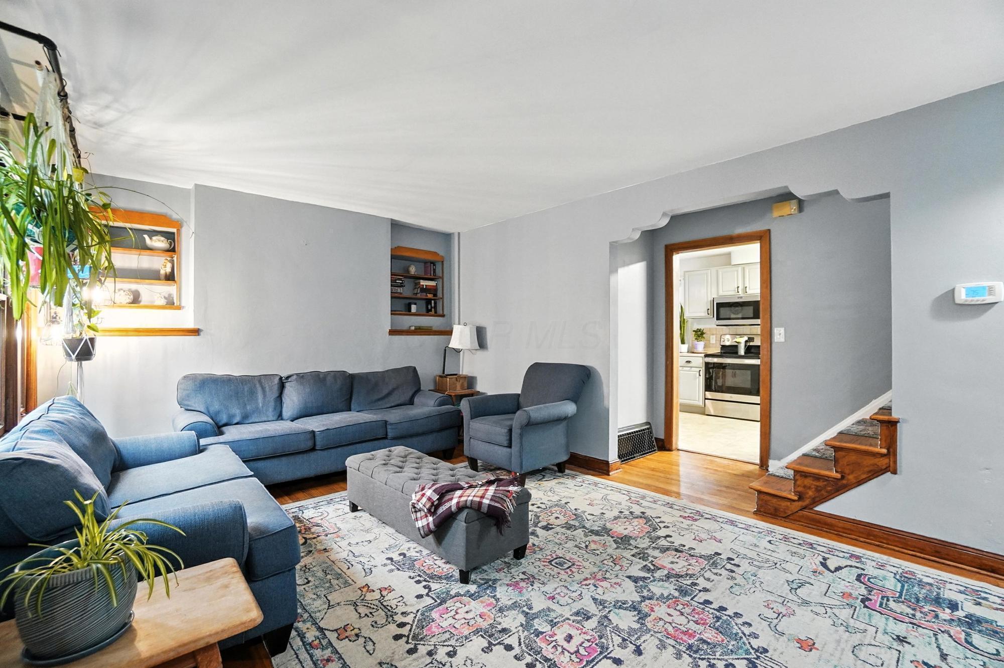 Spacious living room with built-in bookshelves