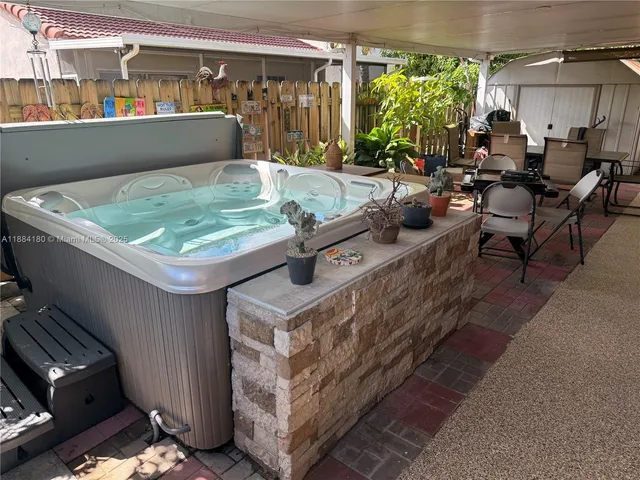 a view of a chairs and table in a patio
