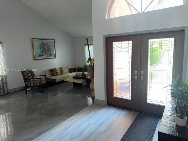 a living room with furniture and a window